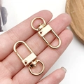 Two pieces of shiny golden 12x33mm swivel lobster clasps for DIY jewelry and keychains - KC Gold Oval Swivel Hook (12777)