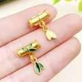 Bamboo shaped gold charm pendant with green enamel leaves and matte finish details - Green Enamel Bamboo Joint with Leaf Charm