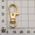 Polished gold alloy lobster clasp with 360-degree swivel D-ring on 35mm scale board - KC Gold Swivel Lobster Clasp (12946)