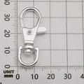 Swivel lobster clasp in silver finish shown on a measurement scale at 37mm length - Bright Silver Swivel Lobster Clasp (12951)