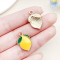 Golden and yellow enamel lemon pendants for DIY jewelry making with leaf details - Yellow Enamel Lemon Style (22184)
