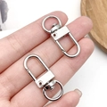 Silver lobster claw swivel clasps made of metal alloy for DIY keychains and bags - White K Oval Door Buckle (12773)