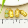Golden peanut pendant charm with green jade-like beads for DIY jewelry making - One 37x8mm 2220g 1.75g ​​[light Green Glass Peanut]