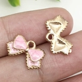Colgante de lazo de esmalte rosa en aleación dorada para pulseras y llaveros DIY - 15.5x10mm / Rosa