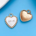 Ciondolo a cuore bianco con incisione Love e bordo dorato per gioielli fai da te - Cuore Love Bianco 13x16mm