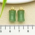 Pair of green faux jade bamboo-shaped pendants with golden metal caps for DIY jewelry making - One 17x8mm Piece Weighing 1.4g Is A Green Glass Bamboo-shaped Piece.