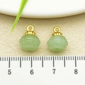 Light green pumpkin-shaped jade pendant with golden metal clasp on beige texture background - One 12x9mm (22261) 1.0g [light Green Glass Pumpkin Bead]