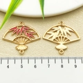 Chinese style gold folding fan pendant with red bamboo leaf enamel and hollow design - Red Enamel Bamboo Leaf Fan (22457)