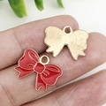 Par de dijes de lazo rojos en esmalte con bordes dorados para bisutería DIY - 18x14mm / Rojo