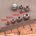 Macro view of silver plated brass spacer beads in various sizes for DIY jewelry making - 1 Copper Plated With White Gold / Cat's Eye Beads - 3x2 Holes 1.5mm [0.06g/0.06g/0.05g]