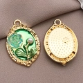 Vintage oval pendant with green rose and pearl detailing on textured brown fabric - Green Drip Oil Oval Rose Plate (19481)