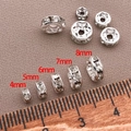 Dettaglio macro di distanziali a rondella argentati con strass in varie dimensioni - 1 Pezzo (Diam 4mm*Spessore 2mm*Foro 1mm) / Argento