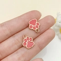 Pink enamel paw print charm in golden metal finish for DIY jewelry and pet tags - Red (23317)
