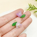 Purple acrylic lily of the valley flower pendant with pearl core and green leaf detail - Purple
