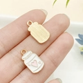Colgante de biberón dorado de aleación con esmalte blanco y corazones para joyería - Biberón de Bebé Esmaltado Blanco (17708)