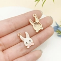 White enamel rabbit pendant charm for DIY jewelry with gold finish and pink bow detail - Pink Long-Eared Bow-Tie Rabbit Style
