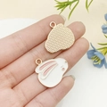 White enamel rabbit charms for DIY jewelry making shown in hand for scale - Enamel White Rabbit Style Four