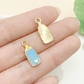 Colgante de biberón azul y dorado para joyería DIY con detalle de corazón - Biberón de Corazón con Escala Azul Lago (22985)