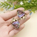 DIY strawberry charms in colorful acrylic with golden leaf clasp on a hand - Transparent Blue AB Iridescent (22940)
