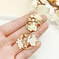 Japanese style rabbit and cherry blossom enamel wreath charms held in hand - KC Gold White Enamel Flower Viewing Rabbit Wreath