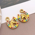 Golden horseshoe and horse head pendant featuring vibrant multicolor enamel inlay detail - Gold Multi-color