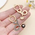 Golden stethoscope DIY charm with black enamel inlay and small diamond accent detail - Large KC Gold Black Enamel Stethoscope (SN23232)