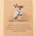 Detail of Virgo zodiac ring set on kraft card with silver open adjustable bands - Virgo