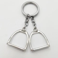 Polished silver alloy stirrup keychain with double equestrian horse riding pendants - Double Stirrup Pendant Style / Silver