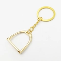 Polished golden stirrup keychain for equestrian lovers with a round metal ring and chain - Single Stirrup Pendant Style / Gold
