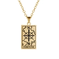 Detailed macro of golden tarot fortune pendant with engraved compass and N S letters - Fortune / Gold