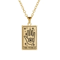 Macro detail of gold tarot card necklace featuring The World engraving and hamsa eye - WORLD / Gold