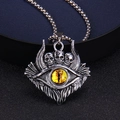 Macro shot of gothic skull pendant featuring a yellow evil eye and aged silver texture - Yellow Eye Style (Style 2)