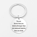 Polished stainless steel round keychain pendant with engraved inspirational quote - Braver Stronger Smarter Style
