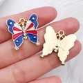 Macro detail of USA flag style butterfly pendant with enamel stars and sparkling rhinestones - Butterfly (19083)