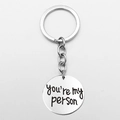 Stainless steel round keychain engraved with 'you're my person' text in silver finish - Long-You're My Person Style