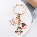Porte-clés de Noël doré avec pendentifs bonhomme de neige et sapin sur plateau blanc - Bonhomme de Neige Flocon Sapin de Noël (ER815)