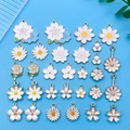 Mix of 30 flower charms with white daisy and cherry blossom designs for jewelry making - Mixed White Enamel Flower Styles (SN743)