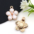 Detail of rose gold flower charms with white enamel petals and textured metal back - White Enamel Cherry Blossom Style (10958)