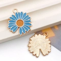 Detailed view of light blue daisy flower charms with golden textured back for jewelry making - Lake Blue Enamel Single-Sided Sunflower (12064) / 18x20mm