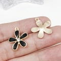 Black enamel flower charm with rhinestone and gold finish back on fingertips - Black Enamel Rhinestone Flower 17x20mm (12102) 1.2g