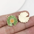 Detailed macro view of green enamel flower pendant with gold metal back and hanging loop - Open Single-sided Sunflower (12068) / 18x20mm