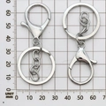 Silver lobster clasp keychain with 30mm flat key ring and chain on a grid mat - Keychain with Chain / 35x65mm / White K/Silver