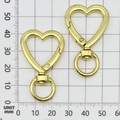 Polished gold heart-shaped spring ring keychain with swivel connector and 25mm size guide - Heart-shaped Keychain Clip / 42x26x5mm / Gold