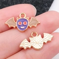 Handheld view of a purple enamel bat pendant for Halloween DIY jewelry making - Purple Enamel Halloween Bat (19508)