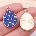 Deep blue enamel Easter egg charm with colorful polka dots and a golden sunburst back - Spotted Egg (15144) / 1 Piece/Pack (14x22mm) / Sapphire Blue