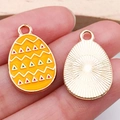 Easter egg charm in yellow enamel with zigzag patterns and golden sunburst back - Easter Egg (15147) / 1 Piece/Pack (14x22mm) / Yellow
