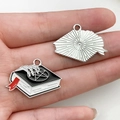 Gothic spellbook enamel pendant featuring white skeleton hand holding a pentagram star - Magic Book Style / 20x29mm
