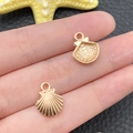 Detailed pair of golden shell charms for DIY jewelry making with realistic sea-themed texture - KC Gold Marine Small Shell Style (11599)