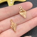 Golden shell charms in KC gold alloy for DIY jewelry making with spiral texture details - KC Gold Marine Shell Style (16228)