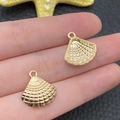 Close-up of small KC gold seashell alloy pendants for DIY jewelry making - KC Gold Marine Shell Style (18308)